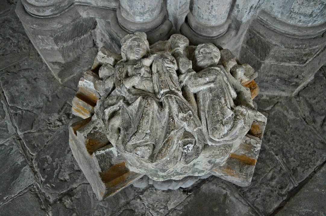 A large carved stone roof boss with figures, saved from the fallen vault of Dore Abbey