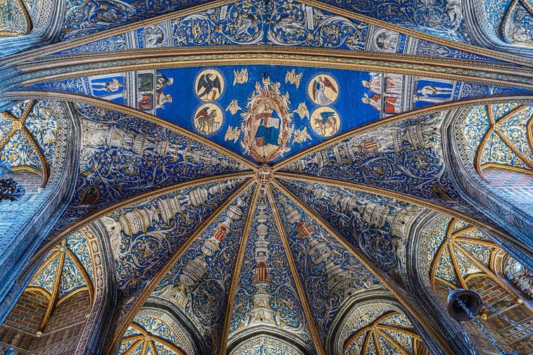 The painted vaults of Albi Cathedral, with saints and ornament in gold on a deep blue ground