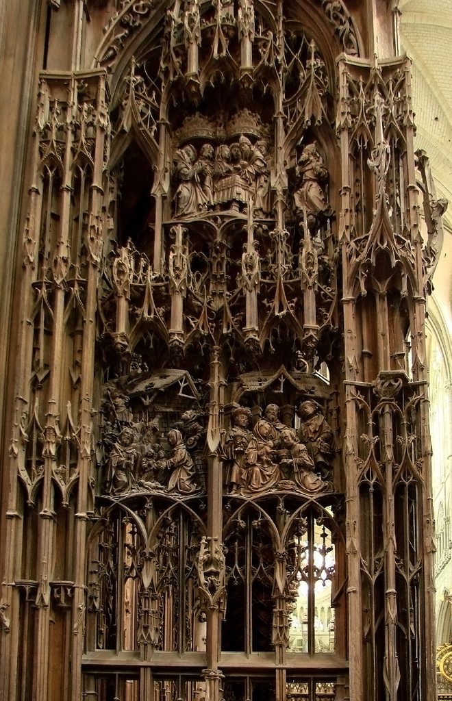 An elaborately carved Gothic wooden pinnacle above the choir stalls of Amiens Cathedral