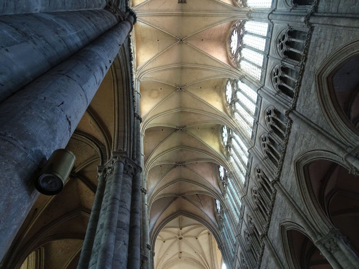 Looking up at the pale ribbed vault and clerestory windows high above the nave of Amiens Cathedral