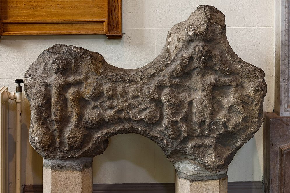 The carved stone head of an eleventh-century high cross in the north aisle of Armagh's Church of Ireland cathedral
