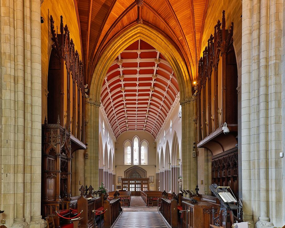 The nave and quire of the Church of Ireland cathedral in Armagh, under a red-painted timber roof