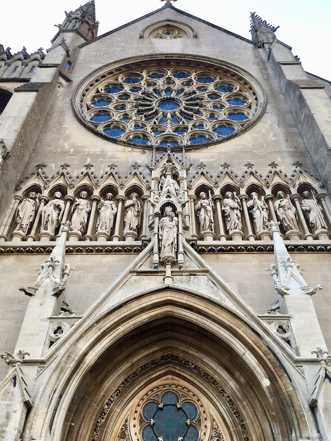 The rose window of Arundel Cathedral, a wheel of stained glass with the Virgin and Child at its centre