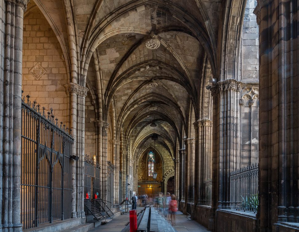 The Gothic cloister of Barcelona Cathedral with palm trees in the garden