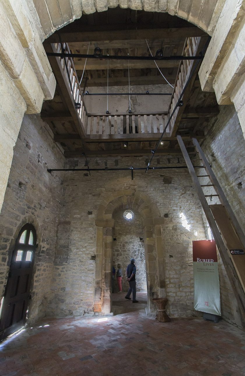 Inside the tall, plain Anglo-Saxon tower of St Peter's, Barton-upon-Humber, looking towards a small doorway
