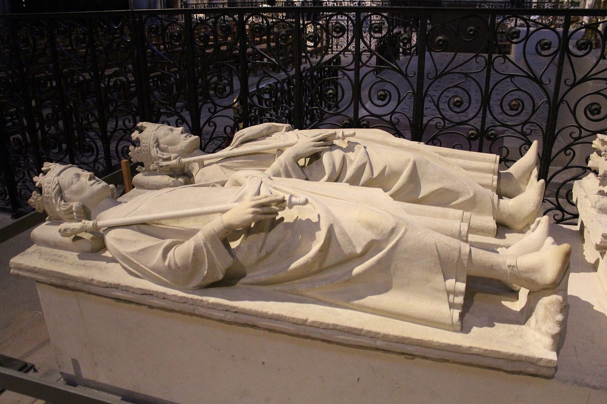 Rows of medieval stone recumbent effigies of French kings and queens in the Basilica of Saint-Denis