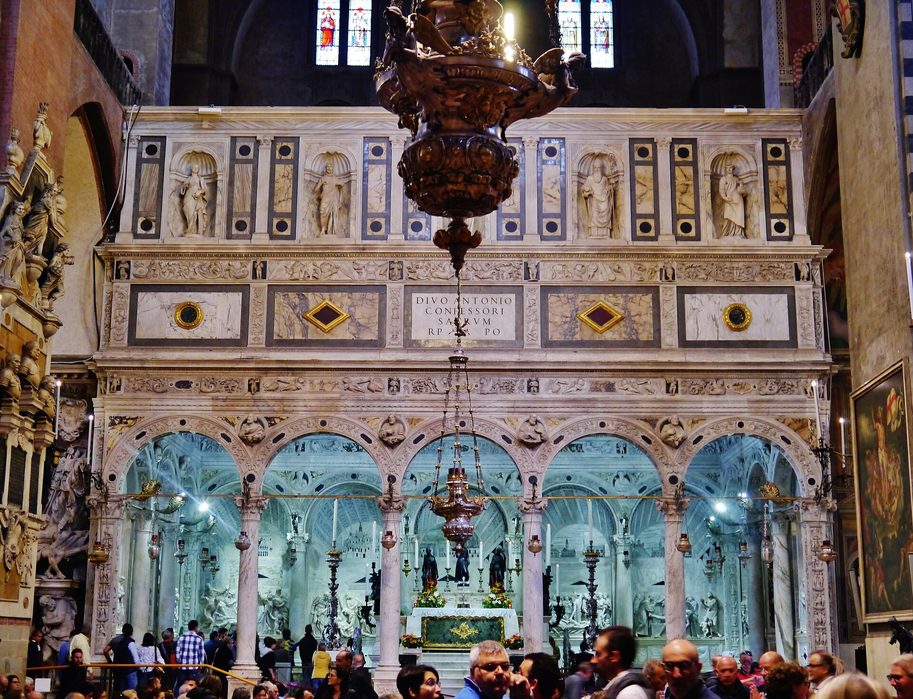 The white marble Renaissance chapel of St Anthony's tomb, with carved reliefs between arches and a gilded vault