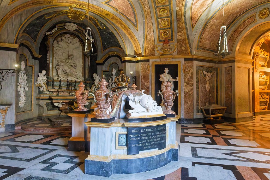 The marble tomb of King Charles Albert of Sardinia in the royal crypt of Superga, with a sculpted figure on the sarcophagus