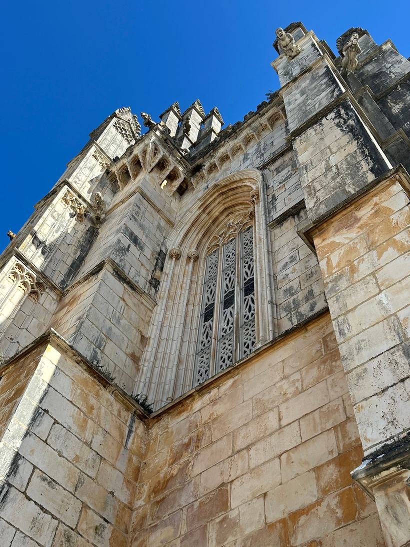 Pinnacles and window tracery on the exterior of Batalha Monastery