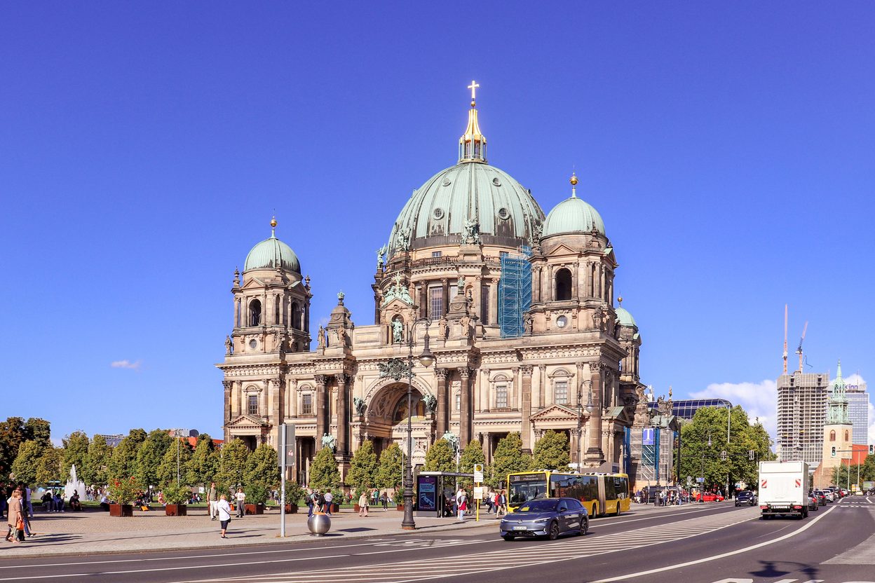 Berlin Cathedral with its great green dome and corner towers, seen across the Lustgarten on a sunny day
