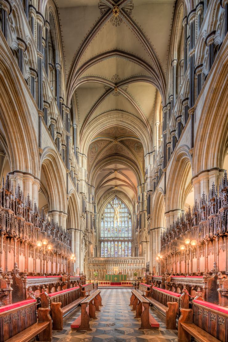 The choir of Beverley Minster with its carved wooden stalls and canopies, looking towards the east window