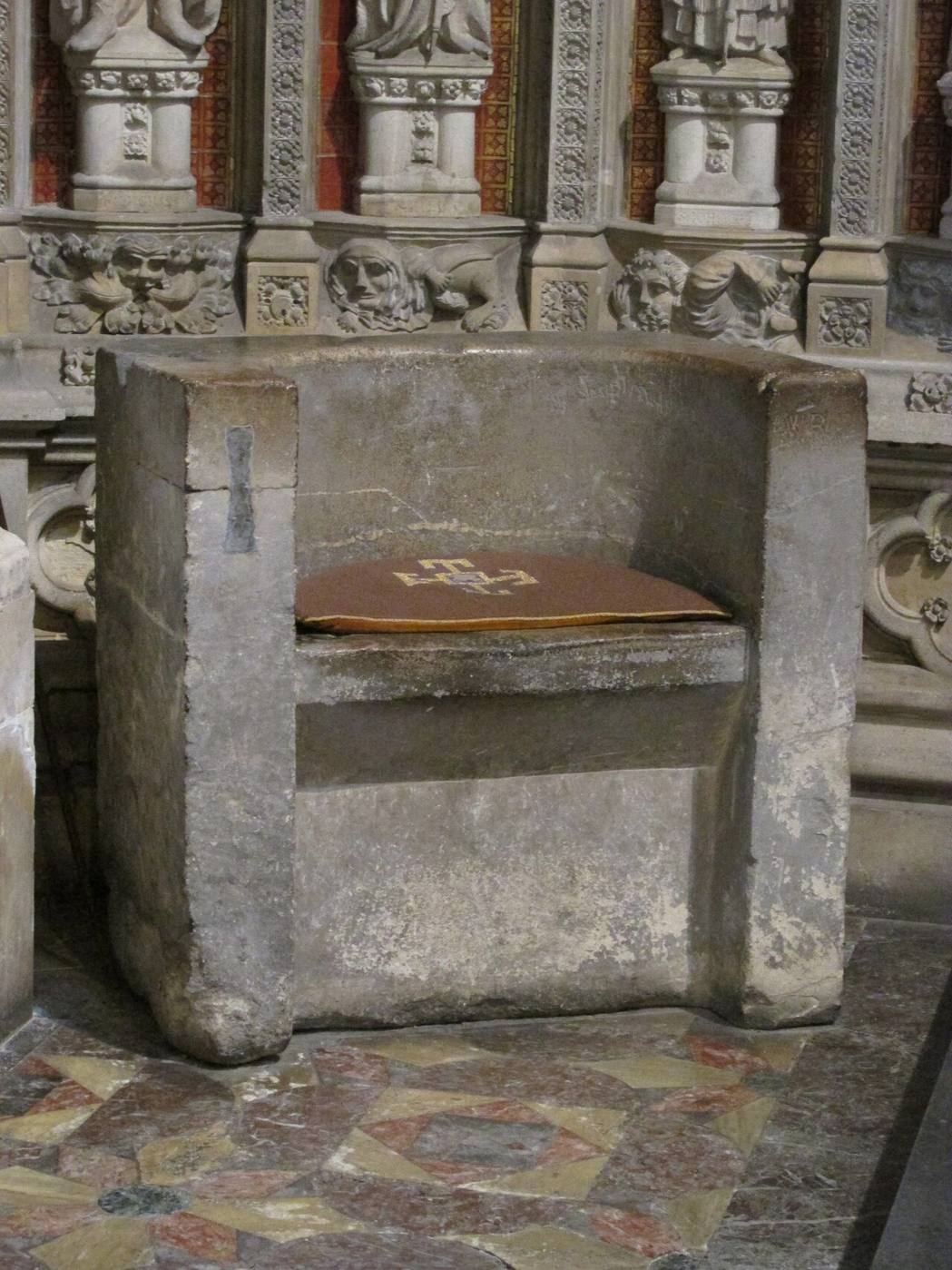 The plain Saxon stone chair known as the Frith Stool in Beverley Minster