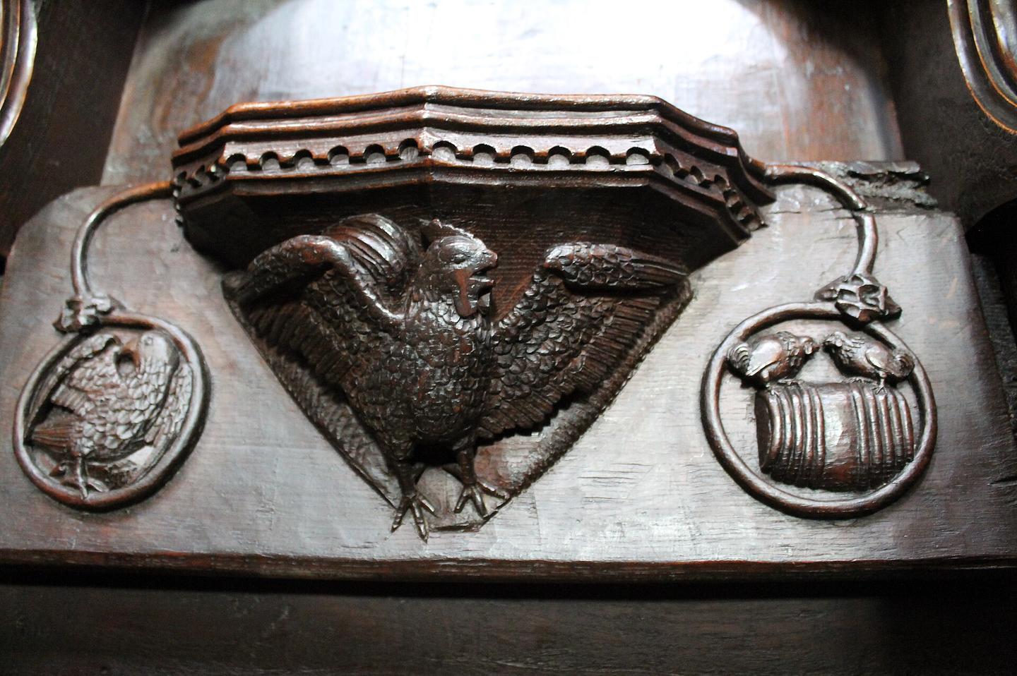 A carved wooden misericord under a choir seat in Beverley Minster