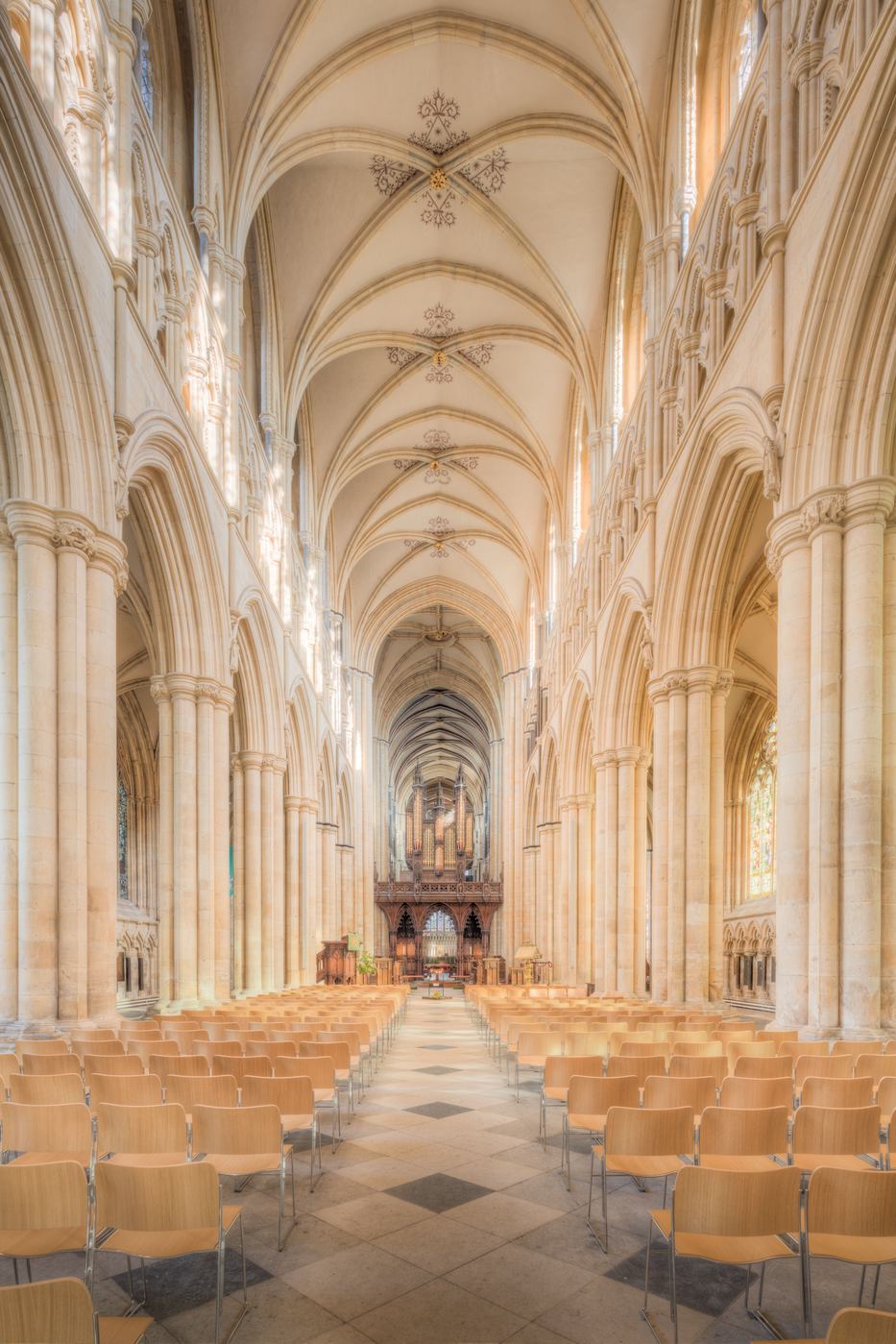 The long Gothic nave of Beverley Minster with its stone vault, looking east