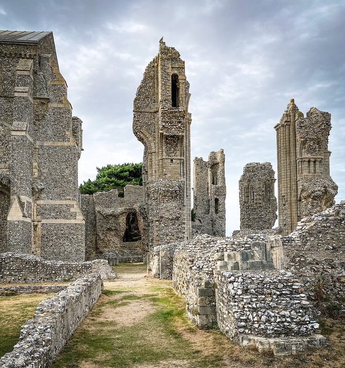 The tall broken flint piers of the ruined crossing and east end of Binham Priory