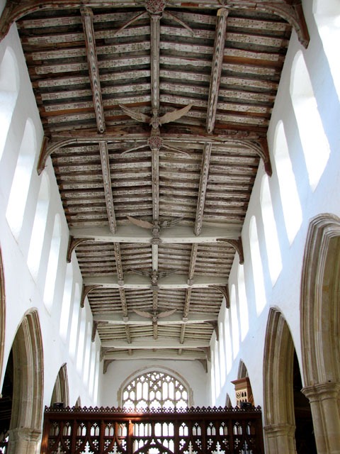 The timber roof of Blythburgh church with carved angels with outstretched wings along the beams