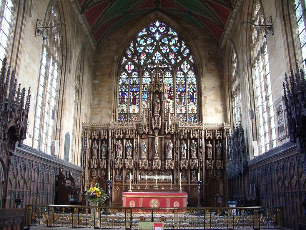 The chancel of St Botolph's with its choir stalls, reredos and great east window