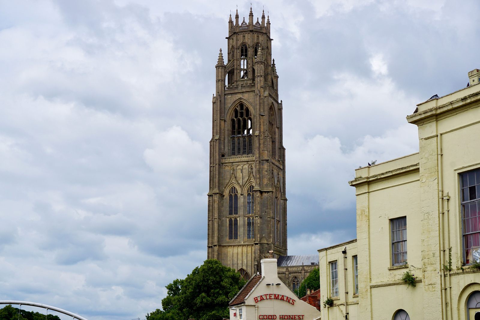 The tower of St Botolph's Church with its octagonal lantern, seen above buildings in Boston