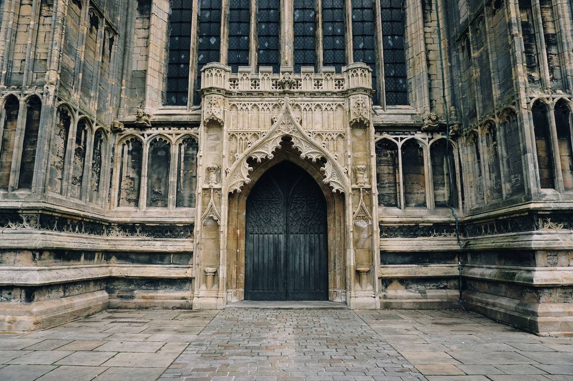 The carved west doorway at the foot of the tower of St Botolph's Church