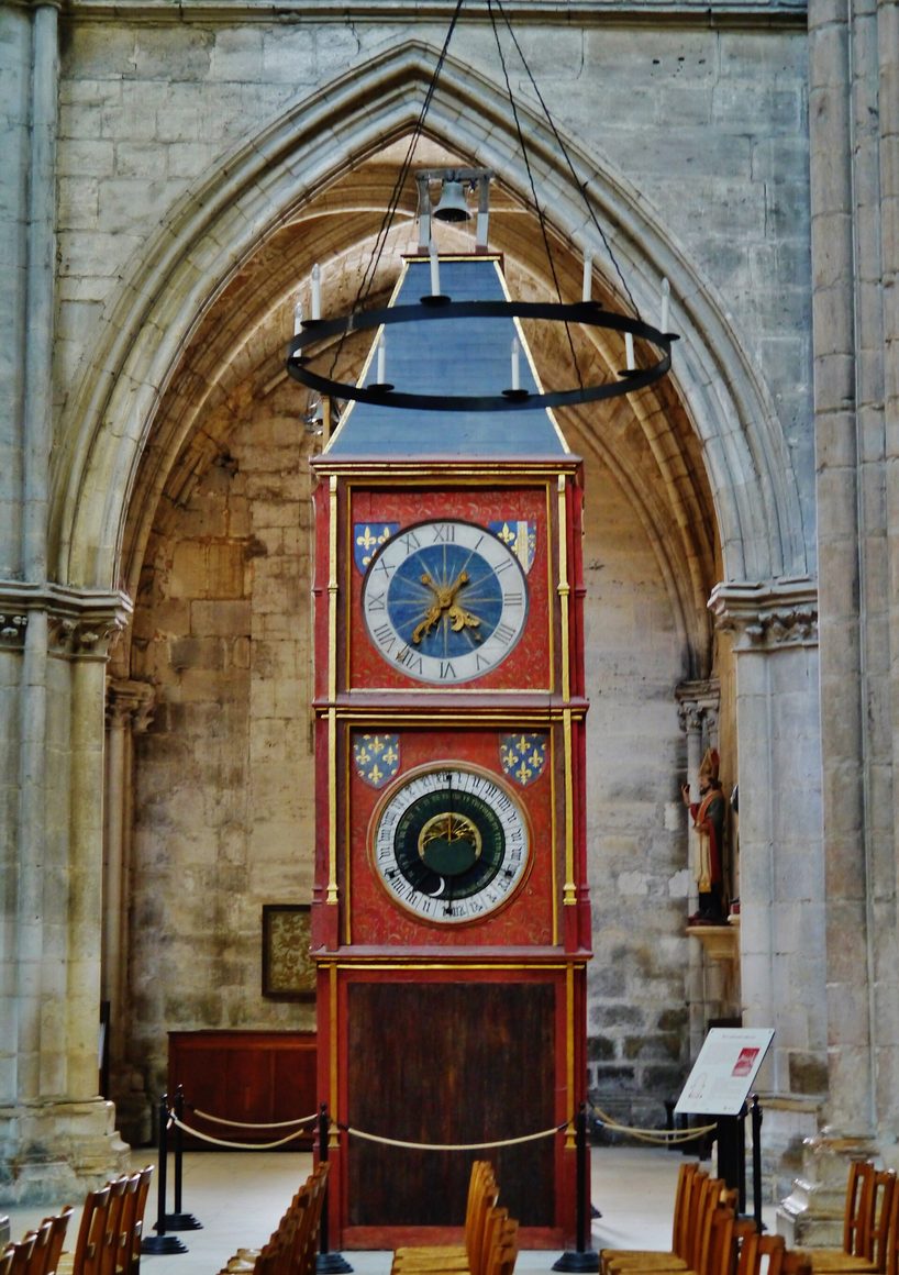 The astronomical clock of Bourges Cathedral, a tall painted wooden case with a large dial