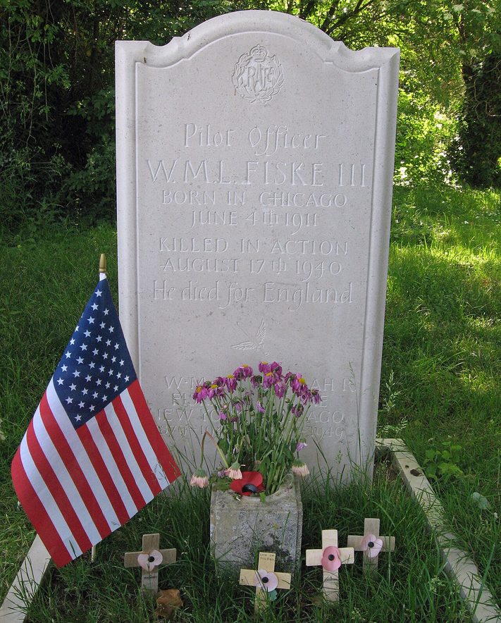 The grave of the American pilot Billy Fiske in Boxgrove churchyard, with flowers and a flag