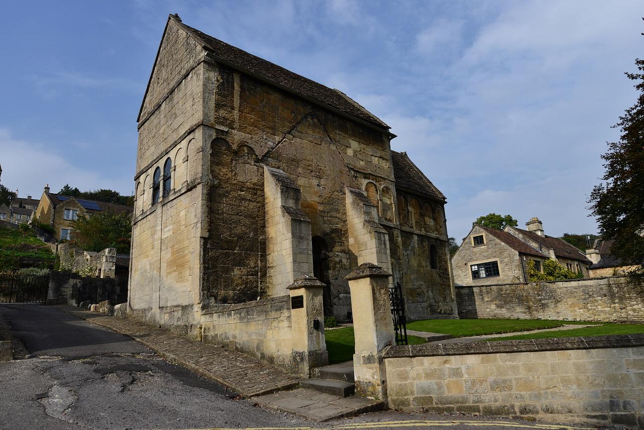 The small, tall stone Saxon Church of St Laurence in Bradford-on-Avon with its steep roofs