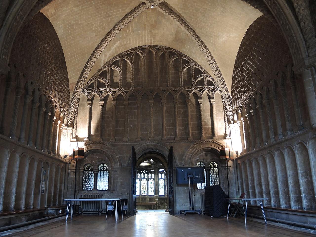The Norman chapter house of Bristol Cathedral with walls covered in zigzag and interlaced carving