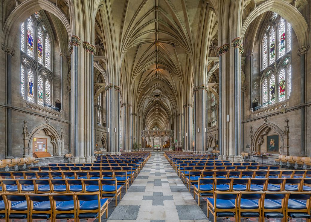 The nave of Bristol Cathedral looking east, with tall arcades and a rib vault