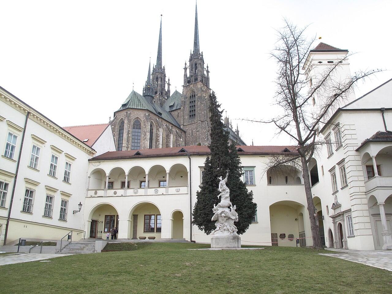 The arcaded courtyard of the Bishop's Court in Brno with the cathedral spires behind