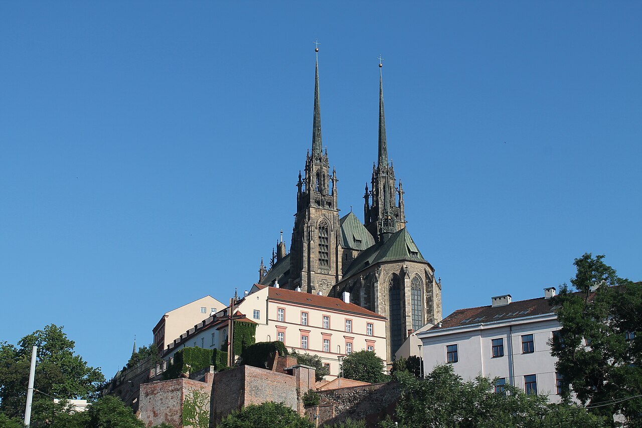 Brno cathedral on its hill seen from below against a clear blue sky