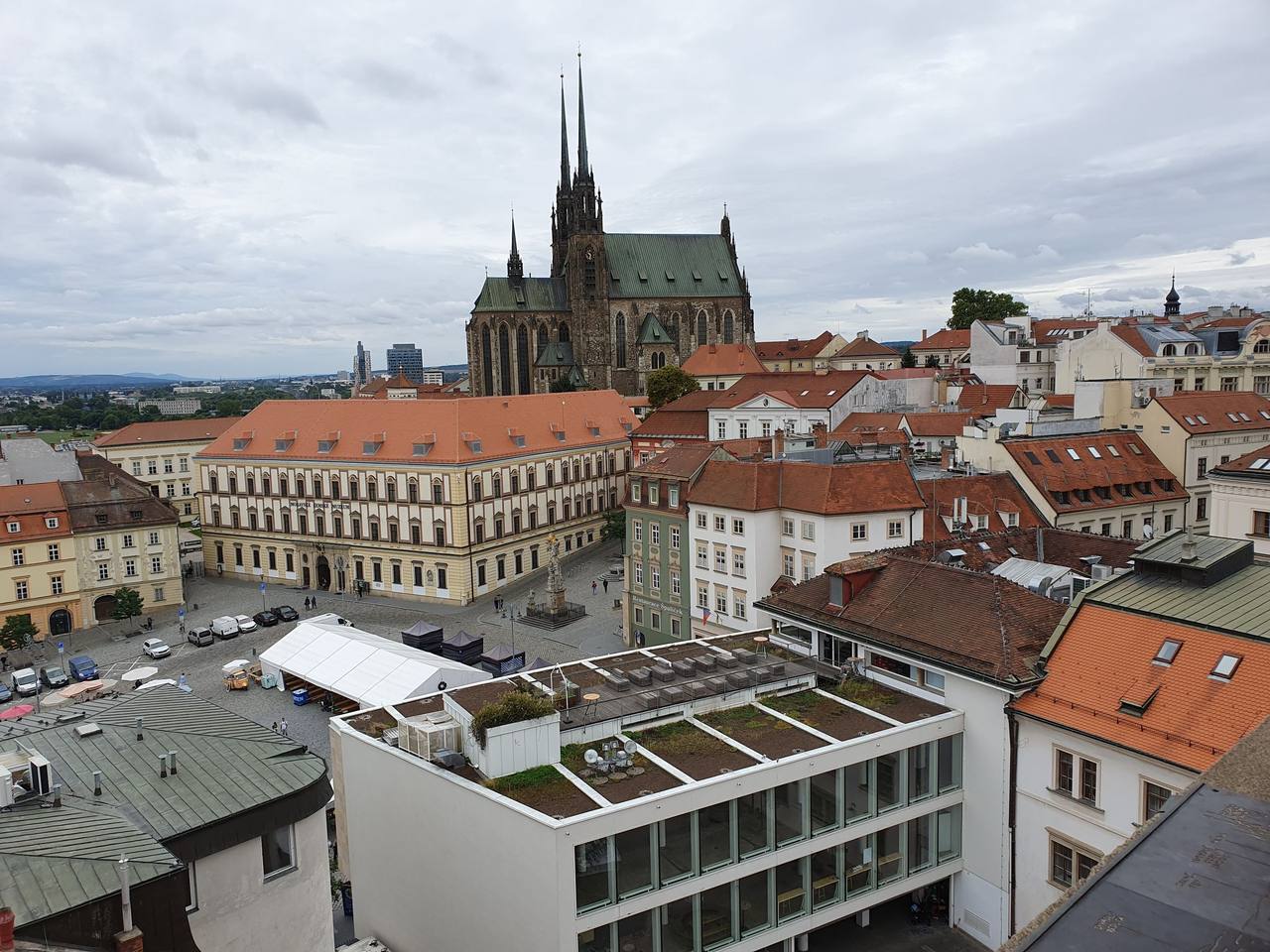 The twin spires of the Cathedral of Saints Peter and Paul rising above the roofs of Brno old town