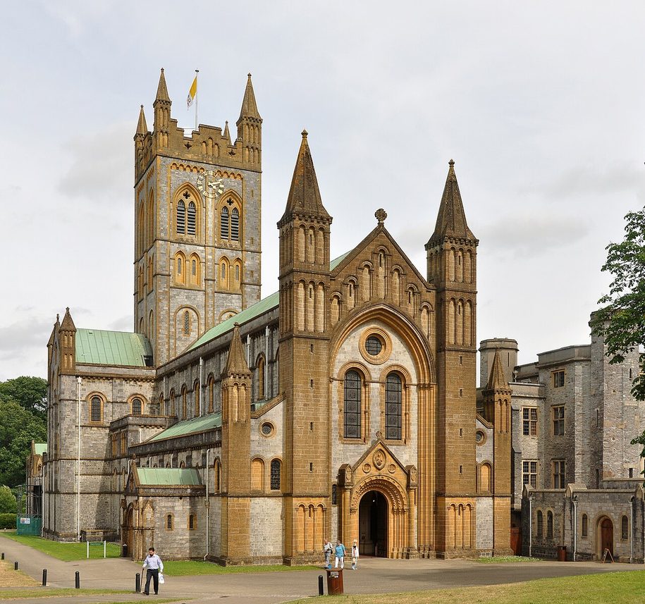 The west front and tower of Buckfast Abbey church, with its round-arched doorway and pinnacles
