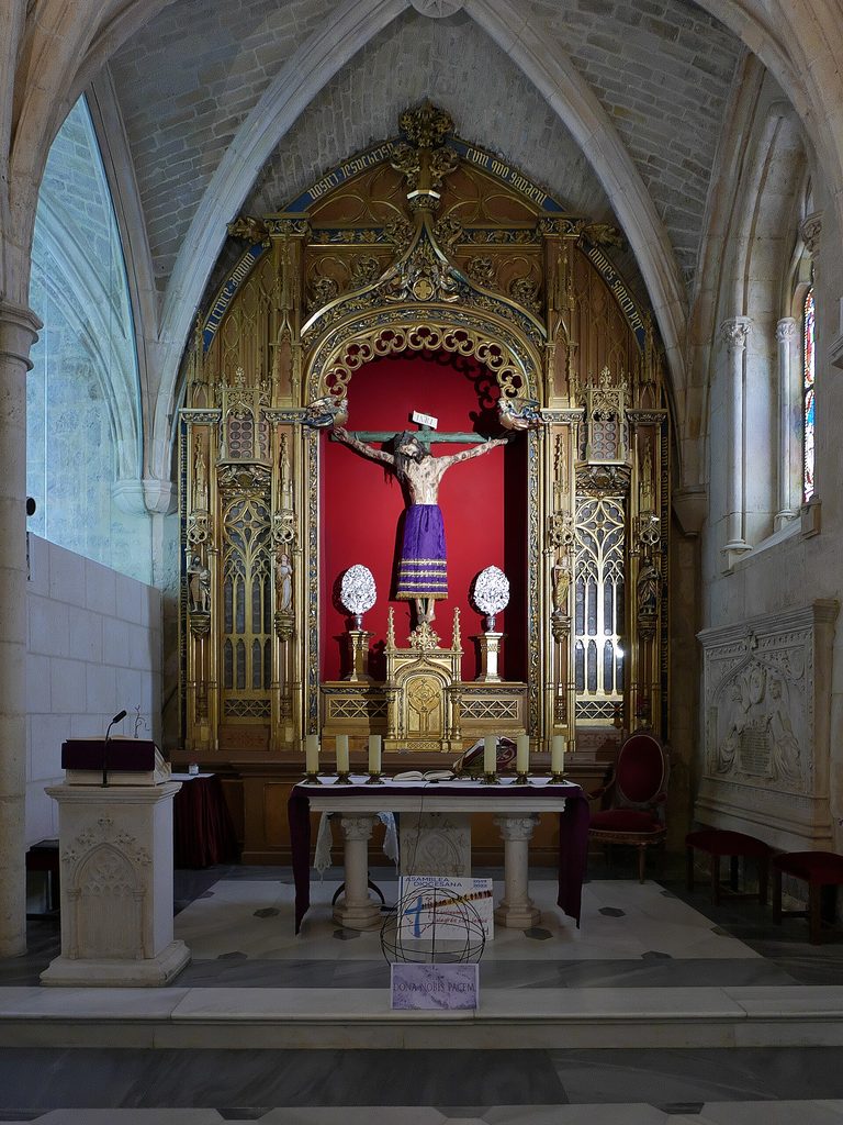 The chapel of the Christ of Burgos, with the crucifix in a skirt above a gilded altar