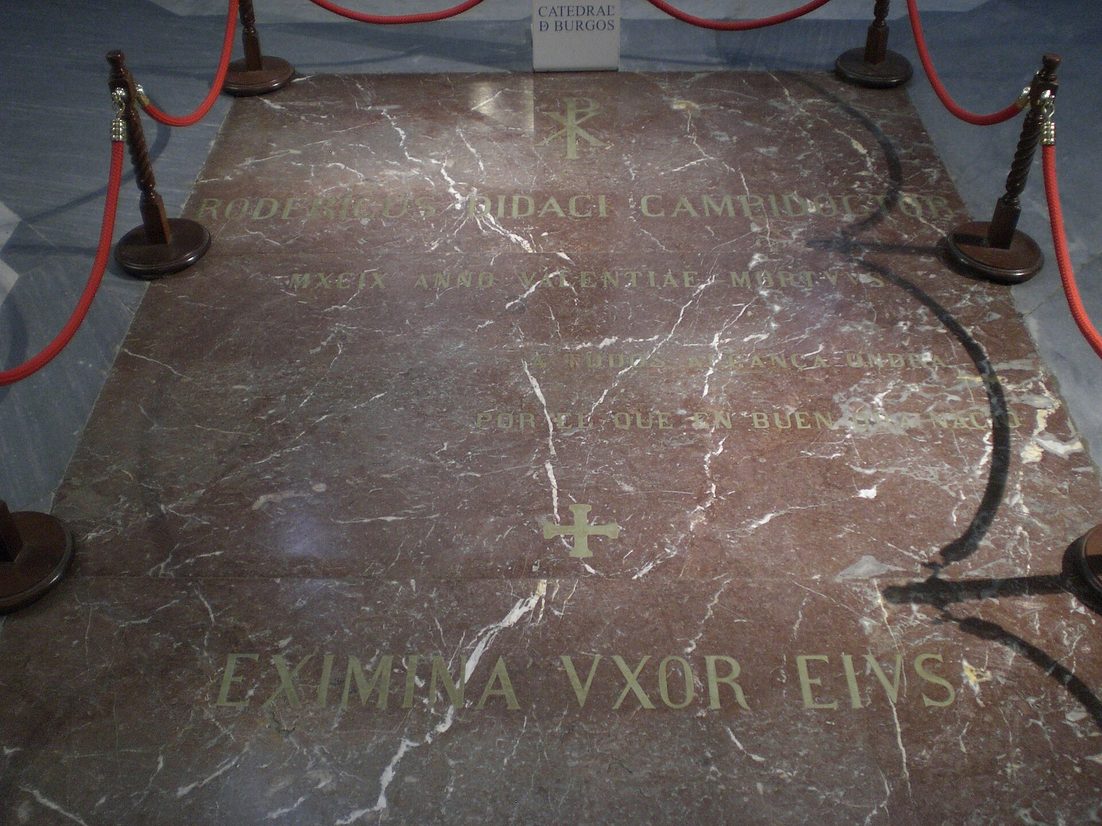 The red marble floor slab marking the tomb of El Cid and his wife Jimena under the crossing of Burgos Cathedral