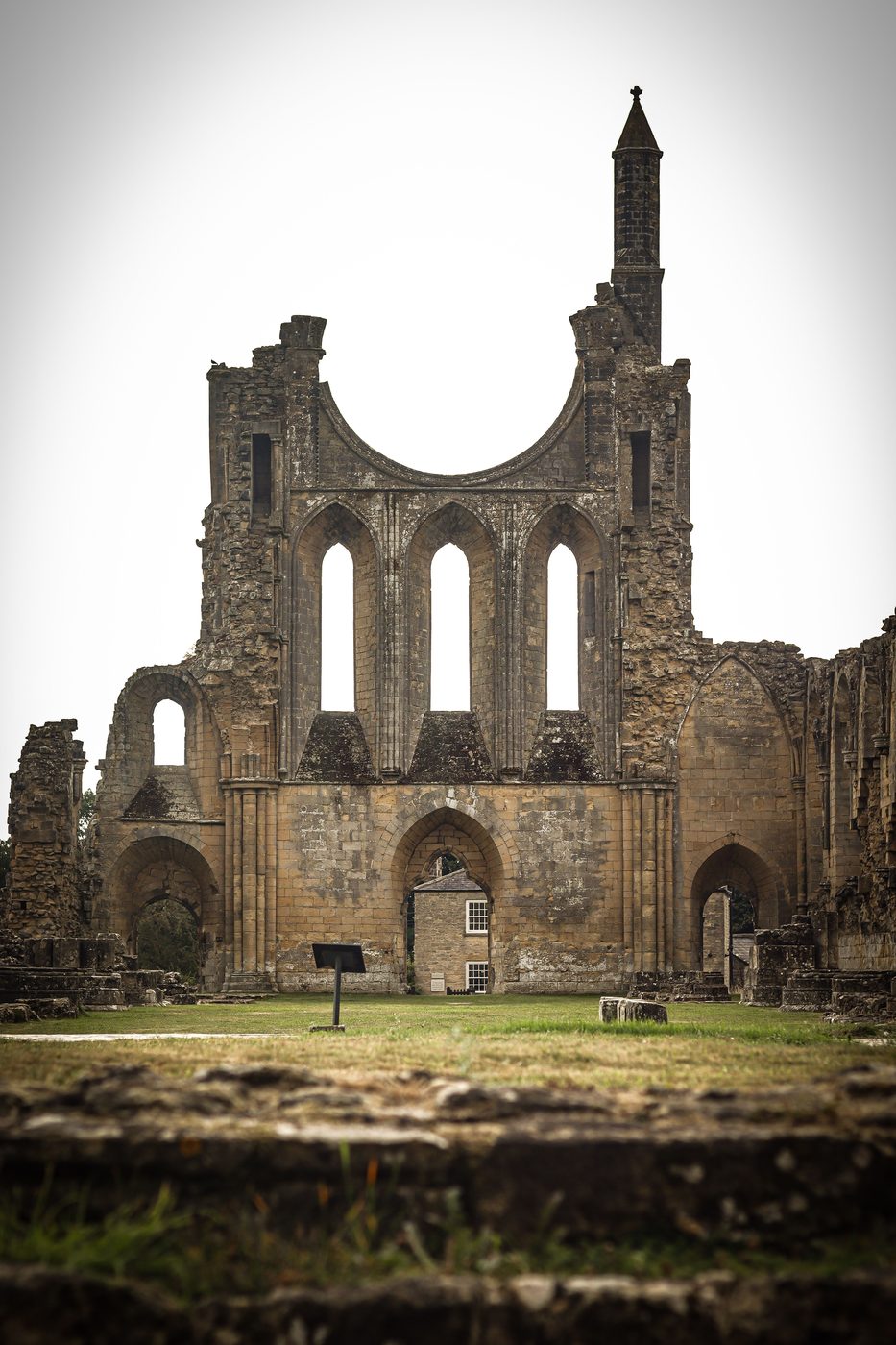 The west front of Byland Abbey with the lower half of its great rose window and a single turret
