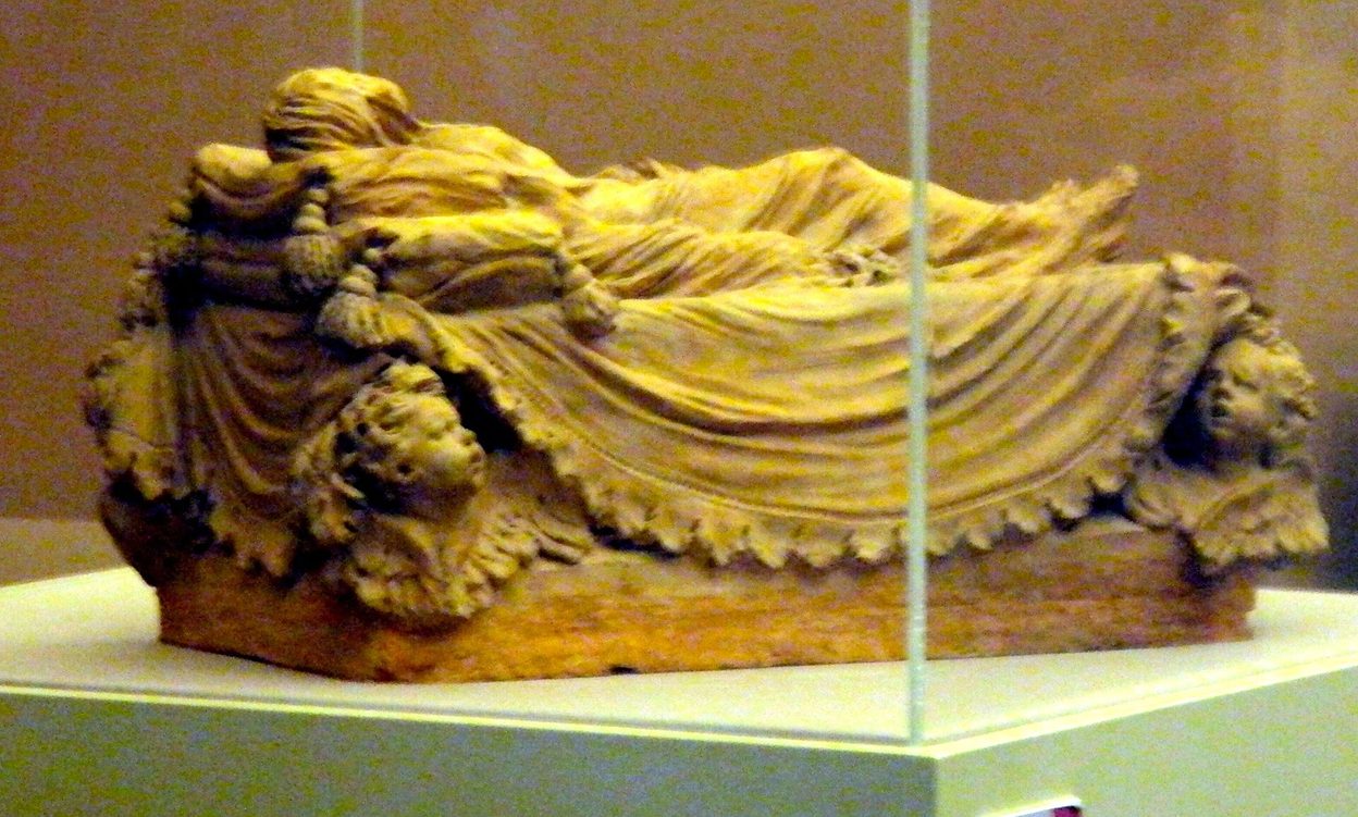 Antonio Corradini's terracotta model for the Veiled Christ, showing a veiled body on a draped mattress, in a glass case