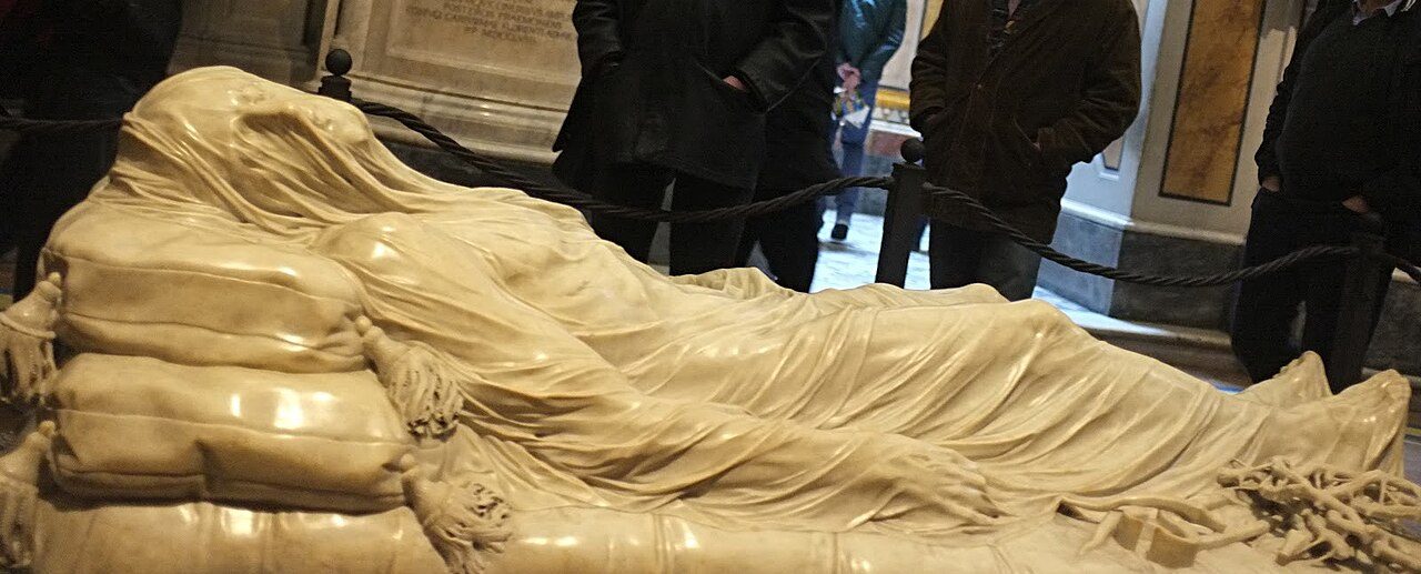 The Veiled Christ by Giuseppe Sanmartino: a marble figure of the dead Christ lying on a mattress under a thin, transparent-looking veil