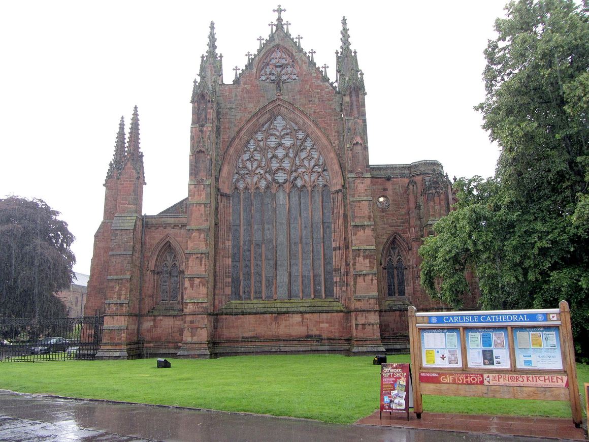 The red sandstone east end of Carlisle Cathedral with its great traceried window