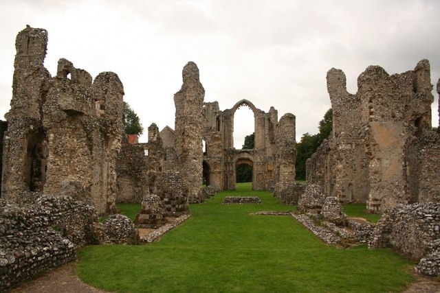 The ruined walls and pillars of the priory church at Castle Acre