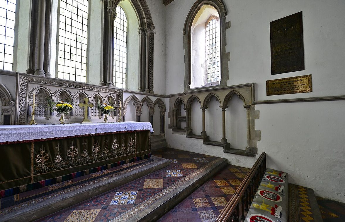 The altar, piscina and three-seated stone sedilia under pointed arches in the chancel of Castle Rising church