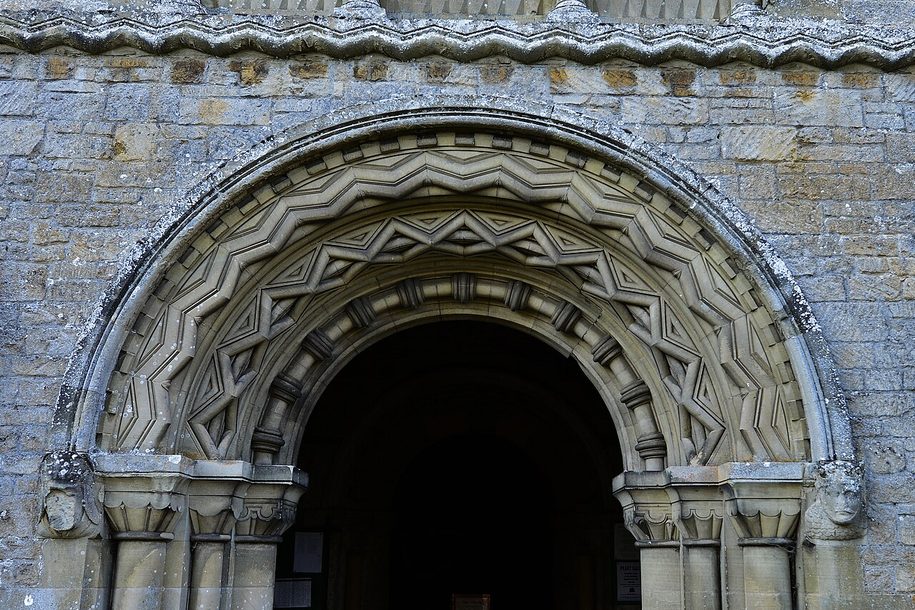 A round Norman doorway carved with bands of zigzag, inside the south porch of Castle Rising church