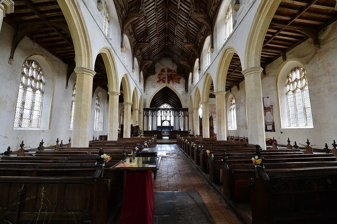 The light nave of Cawston church under its hammerbeam roof, looking east between the arcades