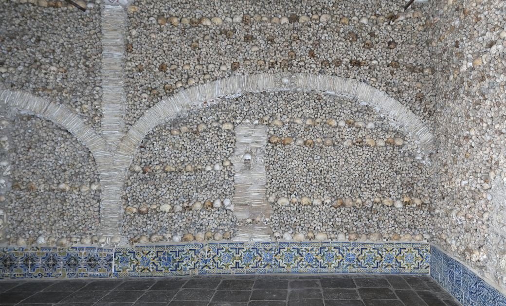 A bone-faced wall and arcade in the Chapel of Bones, Evora