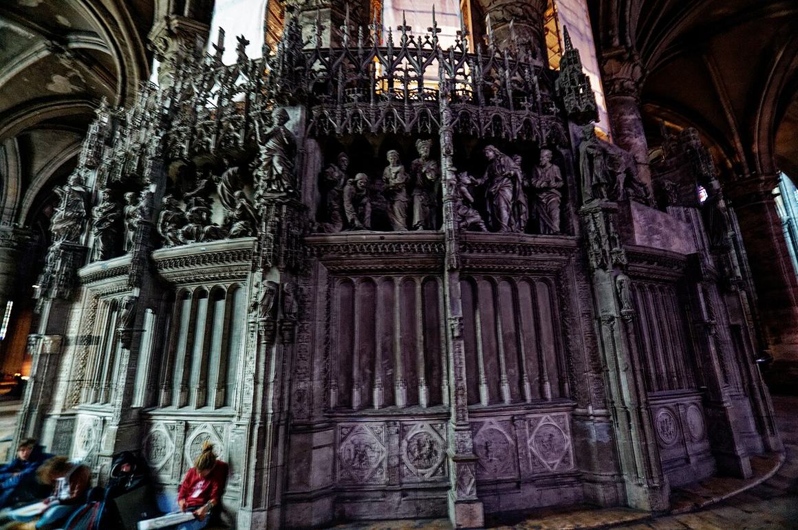 The carved stone choir screen in the ambulatory of Chartres Cathedral