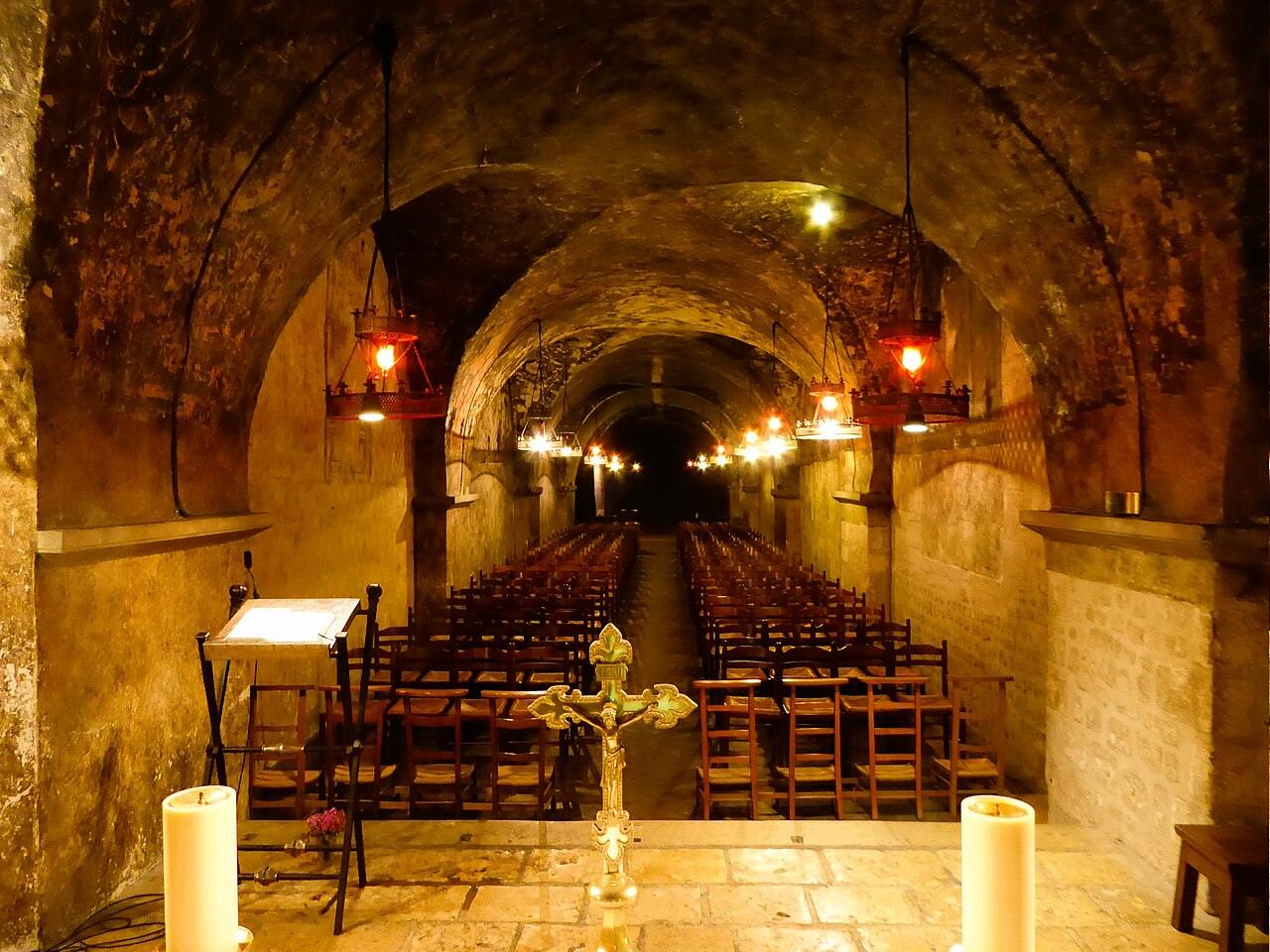 The long vaulted crypt chapel of Notre-Dame-sous-Terre at Chartres with rows of chairs
