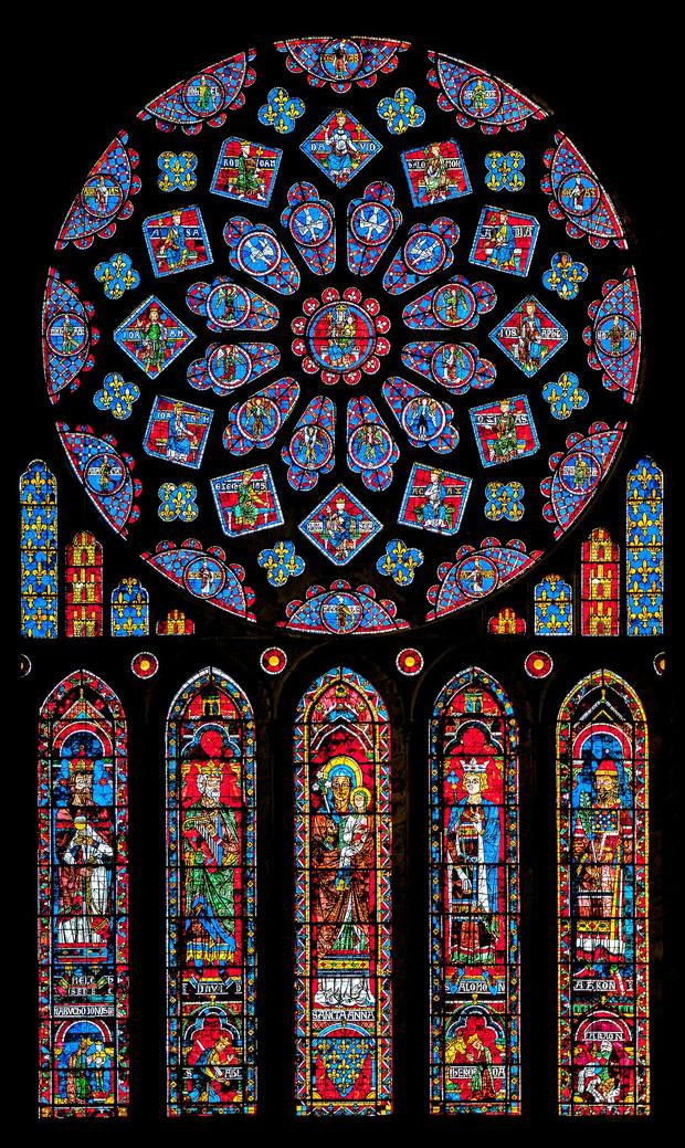 The north rose window of Chartres Cathedral above five tall lancets