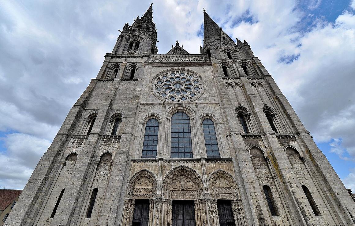 The west front of Chartres Cathedral with its two unmatched spires, seen from below