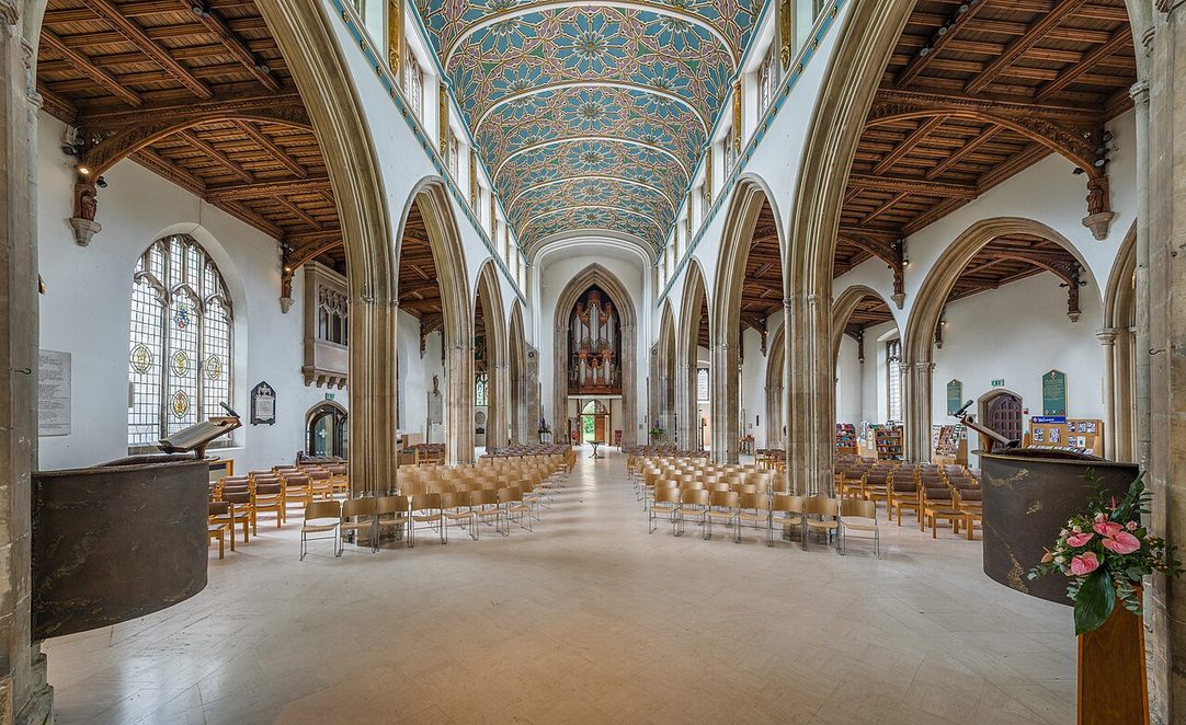 The light nave of Chelmsford Cathedral, with its slender arcades under a painted blue and gold ceiling