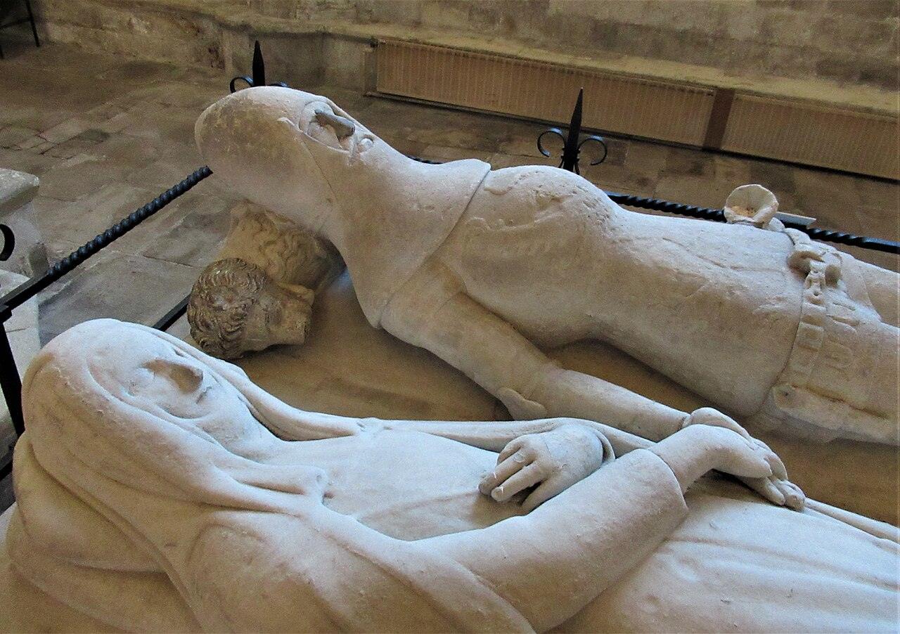 The stone effigies of an earl and countess with joined hands on the Arundel tomb at Chichester