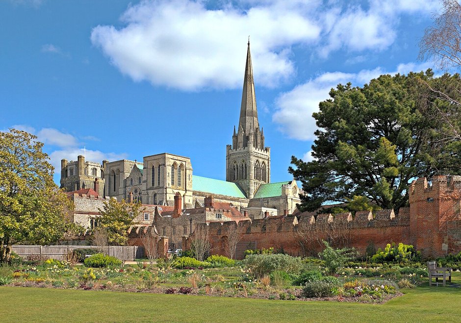 Chichester Cathedral and its spire seen across the Bishop&rsquo;s Palace Gardens